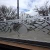 Custom design etched vinyl on glass window.