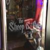 Custom pub logo installed on a beverage cooler door in etched vinyl. (Door open)